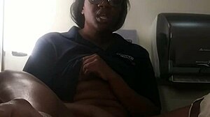 Ebony babe masturbates on bathroom counter, fingering her big ass close-up.