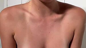 stella cardo teasingly shows off her huge natural tits in a cute way