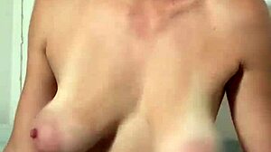 stella cardo teasingly shows off her huge natural tits in a cute way