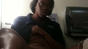 Ebony babe masturbates on bathroom counter, fingering her big ass close-up.