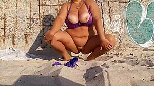 hot milf masturbates on beach feeling so horny outdoors