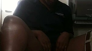 Ebony babe masturbates on bathroom counter, fingering her big ass close-up.