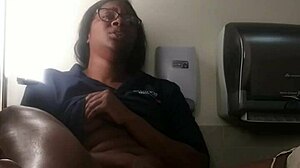 Ebony babe masturbates on bathroom counter, fingering her big ass close-up.