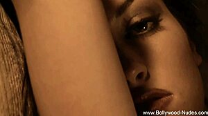 Beautiful Indian brunette undresses and dances naked, teasing with ripped clothes.