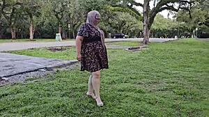 Big ass hijab Muslim milf pissing and fingered by stranger in park.