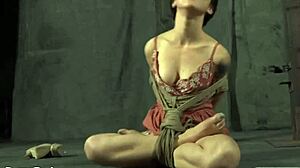 Gagged hotty gets whipped on tits.