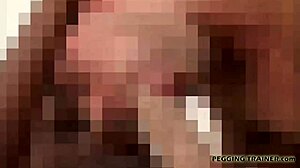 She dominates him with her strap-on deep inside his ass, humiliating the submissive guy in intense femdom play.