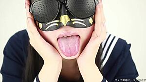 This asian girl in a tongue spit fetish video uses her saliva and tongue in a japanese style