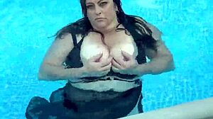 Big natural tits bouncing in the pool.