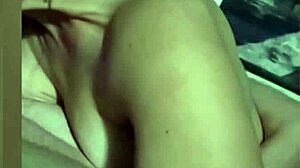 Horny and wet, she moans during masturbation with dildo while family is awake.