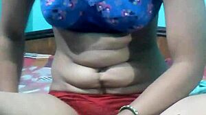 kavita slowly removes her dress on webcam