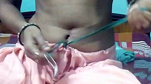 kavita slowly removes her dress on webcam