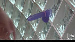 Lexi Belle shares her toy in the shower with a friend