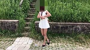 Walking around in my white outfit, flashing publicly for skysexfree