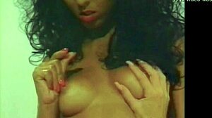 Lesbian pornstars double masturbate and lick in vintage shower scene.