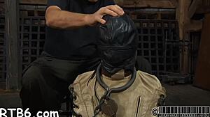 caged beauty gets whipped on smooth ass 😈