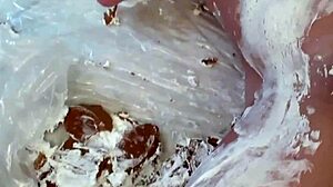 Maggie Green fucks herself with a dildo, her big tits covered in cream, it's so hot.