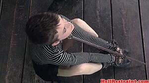 hogtied participant gagged and controlled in session