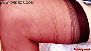 Lucy gresty in stockings and heels undresses slowly, revealing her curvy hairy body and big tits