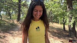 Beautiful woman enjoys ferris wheel ride in amusement park