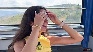 Beautiful woman enjoys ferris wheel ride in amusement park