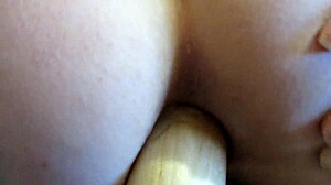 Mature brunette milf stretches her ass with large insertions in amateur doggy style