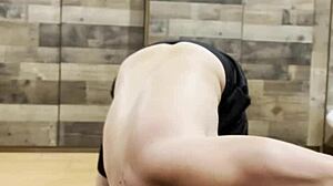 Muscular Bodybuilder Stretches Sensually