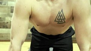 Muscular Bodybuilder Stretches Sensually