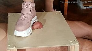 hungarian domina stomps slave's cock in pink boots for humiliation