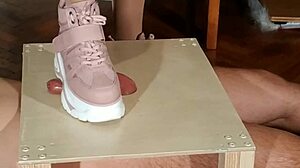 hungarian domina stomps slave's cock in pink boots for humiliation