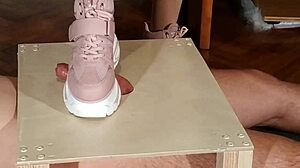 hungarian domina stomps slave's cock in pink boots for humiliation