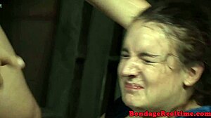in the bdsm scene, the stockinged sub gets throatfucked by the maledom, choking and gagging in bondage