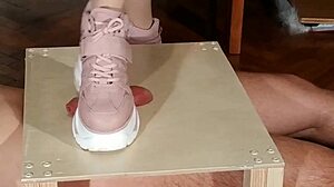 hungarian domina stomps slave's cock in pink boots for humiliation