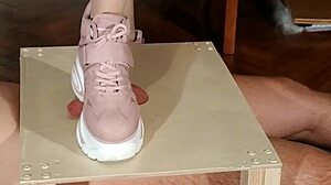 hungarian domina stomps slave's cock in pink boots for humiliation