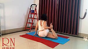 Regina noir practices nude yoga in the gym.