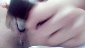 Watch this solo babe masturbate her shaved pussy to orgasm in close-up