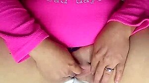 horny babe squirts from fingering her shaved pussy!