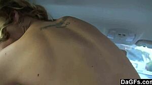 Blonde teen gives handjob in car while driving outdoors