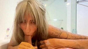 intriguing blonde milf uses tongue on guy's dick in wet bathroom pov blowjob