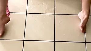 Young girl caresses herself and squirts hard in living room chaos.