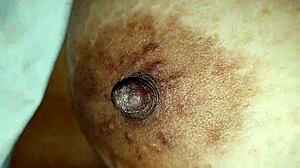 Squeezing my stepmom's big nipples while she moans