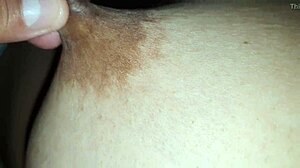 Squeezing my stepmom's big nipples while she moans