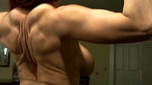 Busty bodybuilder shows off muscles while riding hard