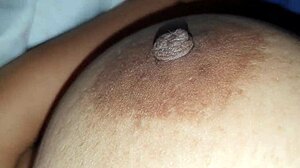 Squeezing my stepmom's big nipples while she moans