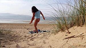 I filmed a curvy milf changing clothes and doing exercises on the beach