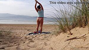 I filmed a curvy milf changing clothes and doing exercises on the beach