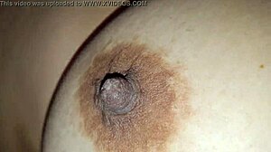 Squeezing my stepmom's big nipples while she moans