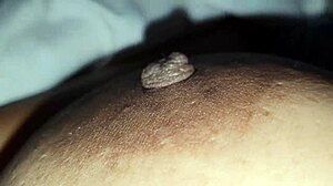 Squeezing my stepmom's big nipples while she moans