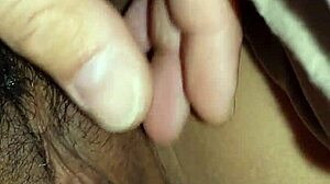 Close-up fingering pussy and ass in masturbation.