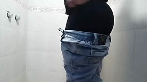 Person masturbates in the bathroom with a vibrator, part one.